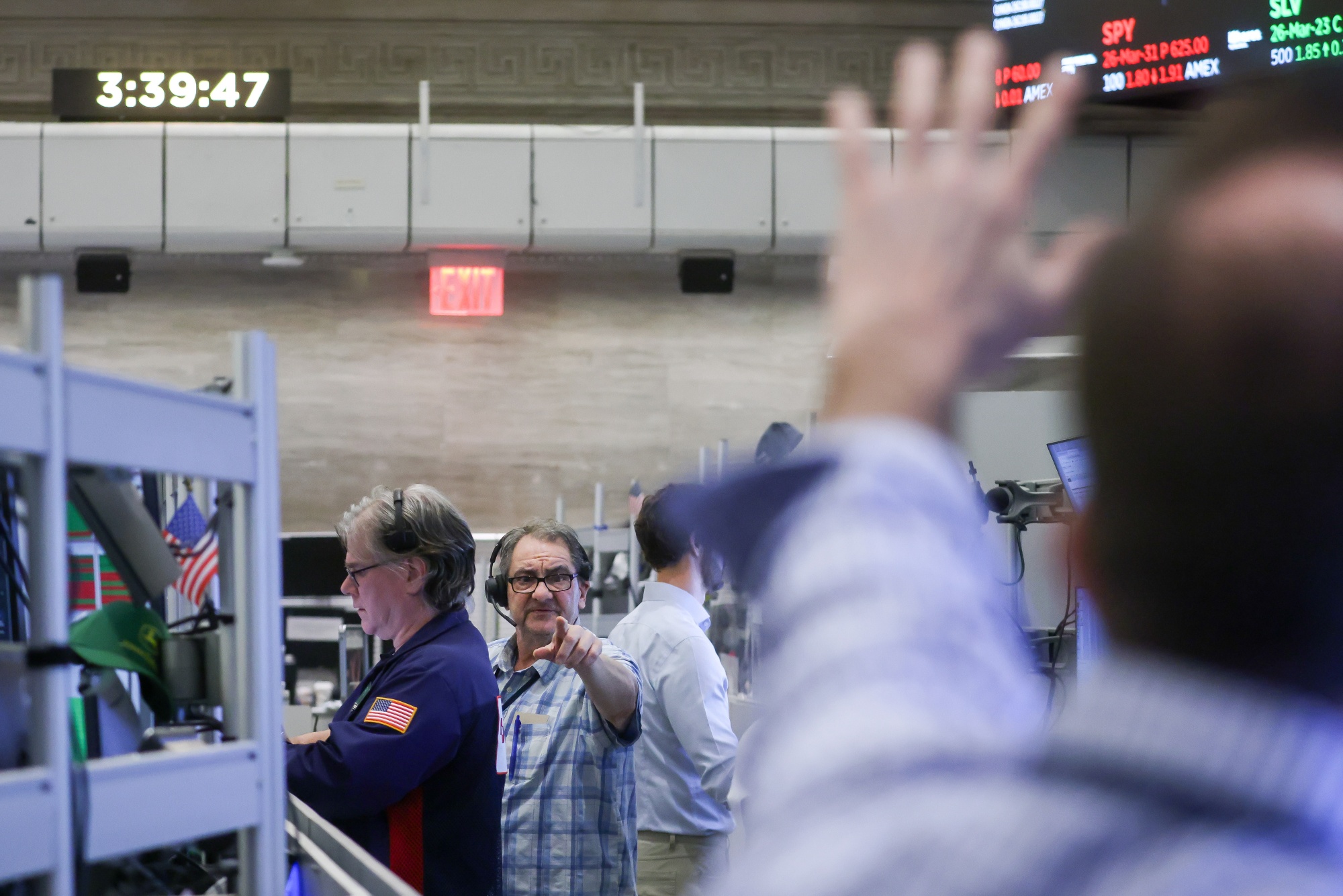 Traders work on the floor of the American Stock Exchange (AMEX) at the New York Stock Exchange (NYSE) in New York, US, on Monday, March 23, 2026. US stocks rallied on Monday after President Donald Trump ordered the Pentagon to hold off on military strikes against Iranian energy infrastructure, spurring a retreat in oil prices.