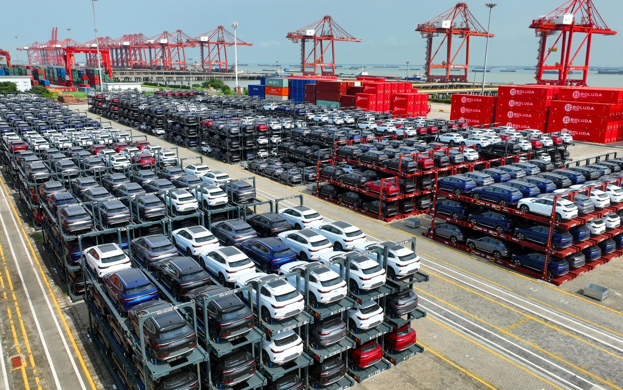 Electric vehicles wait&nbsp;to be loaded for export at Suzhou Port, China.