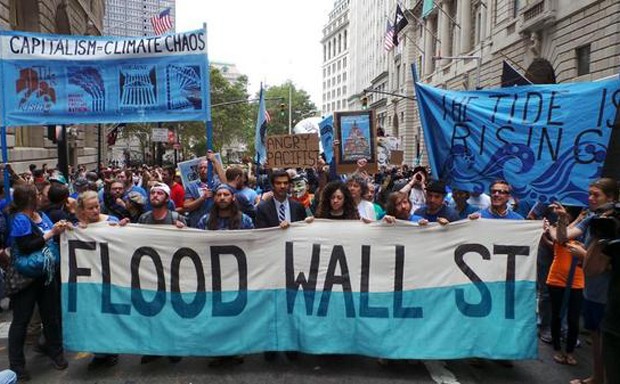 Protesters have descended upon downtown NYC to protest Wall Street's role in climate change.