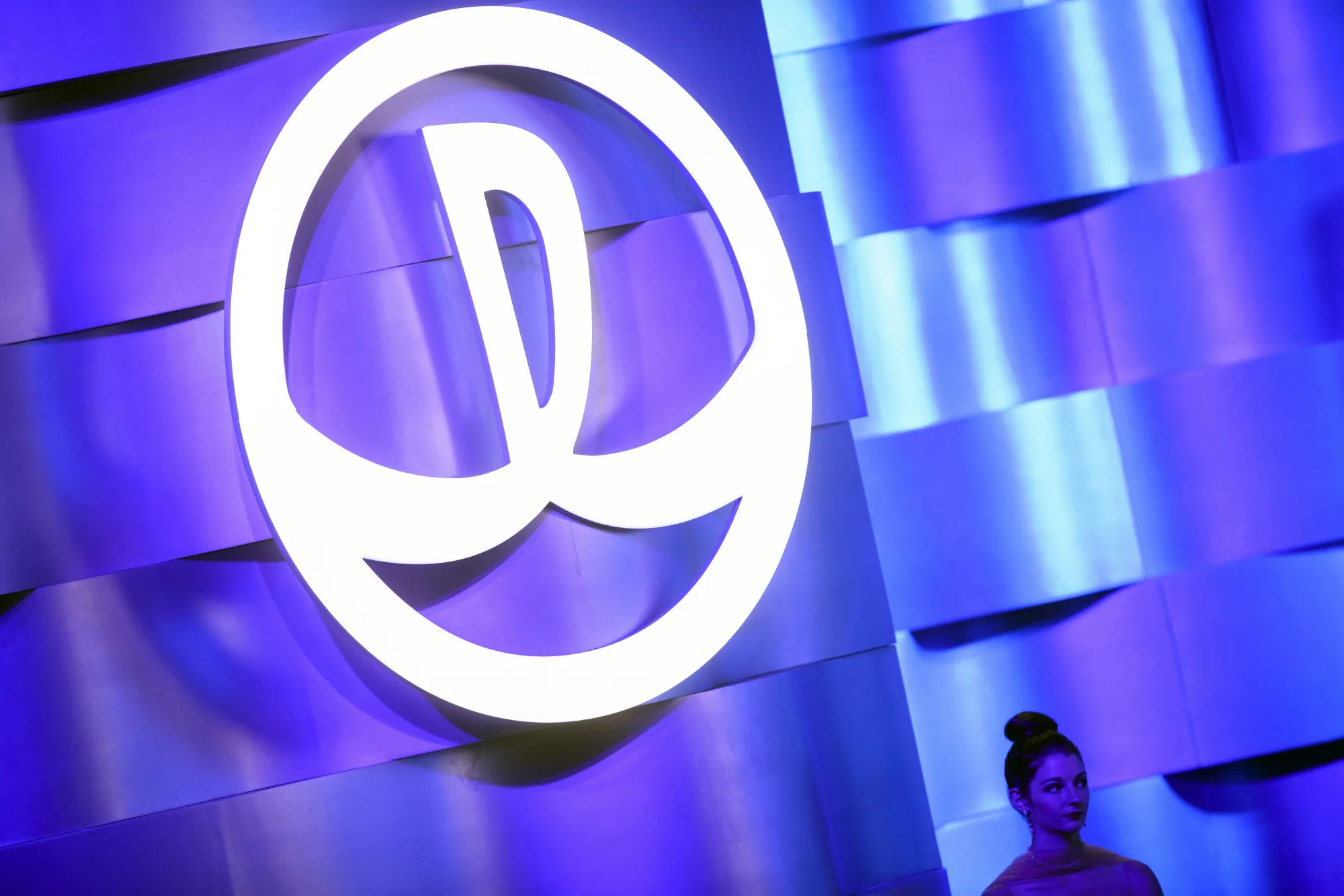 The Dalian Wanda Group Co. logo is displayed at an event in Los Angeles, California, U.S., on Monday, Oct. 17, 2016. Billionaire Wang Jianlin unveiled subsidies worth more than $150 million a year to lure film makers to his new studio complex in China's coastal city of Qingdao.