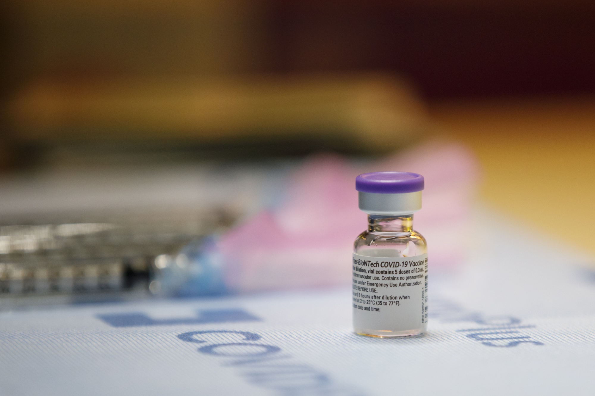 Healthcare workers receive vaccines at a hospital network vaccination clinic