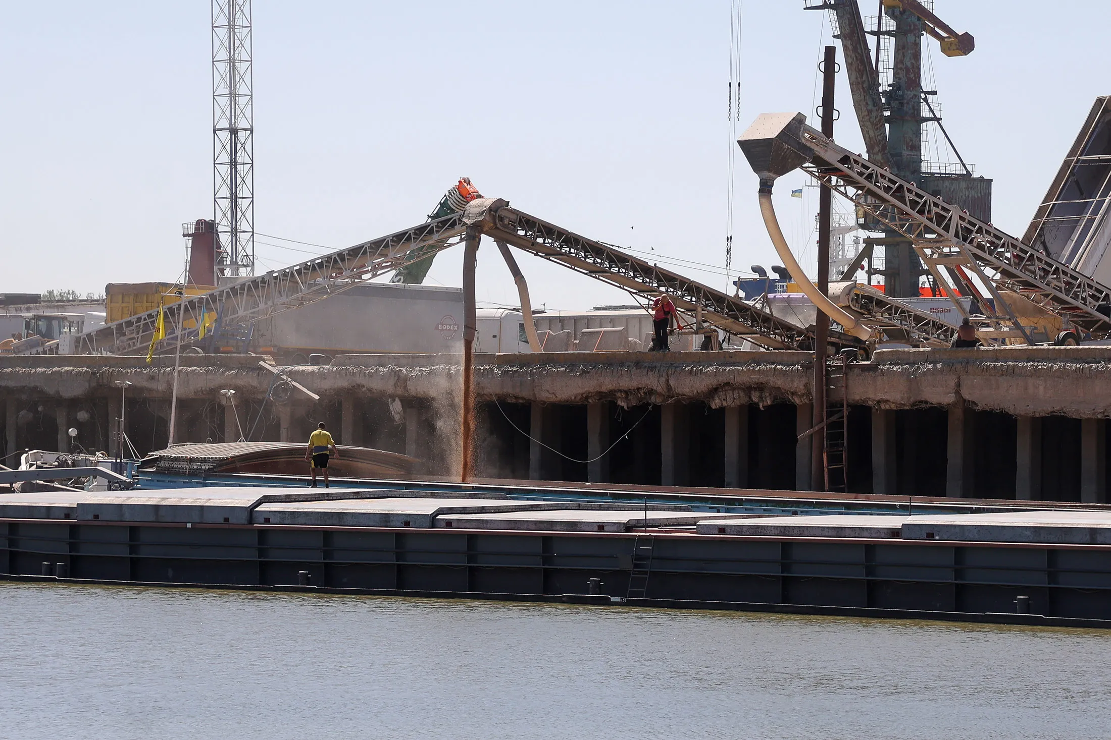 Barges are loaded with grain at Reni river port on Danube river, in the Odesa region, Ukraine, on July 21.