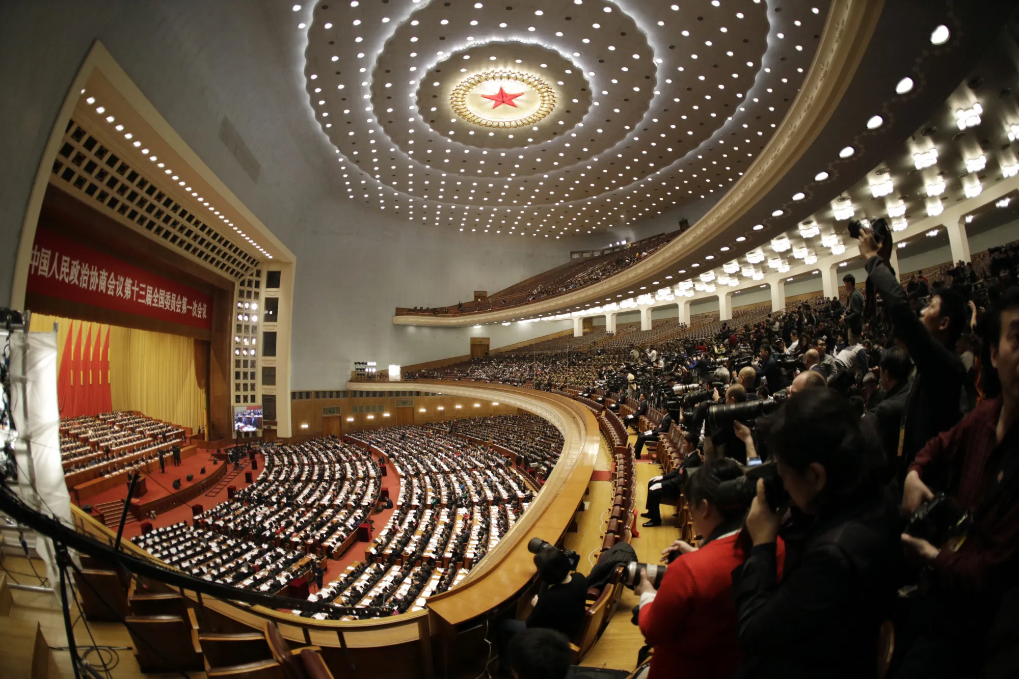Delegates attend the opening of the first session of the 13th Chinese People's Political Consultative Conference (CPPCC) at the Great Hall of the People in Beijing, China, on March 3.
