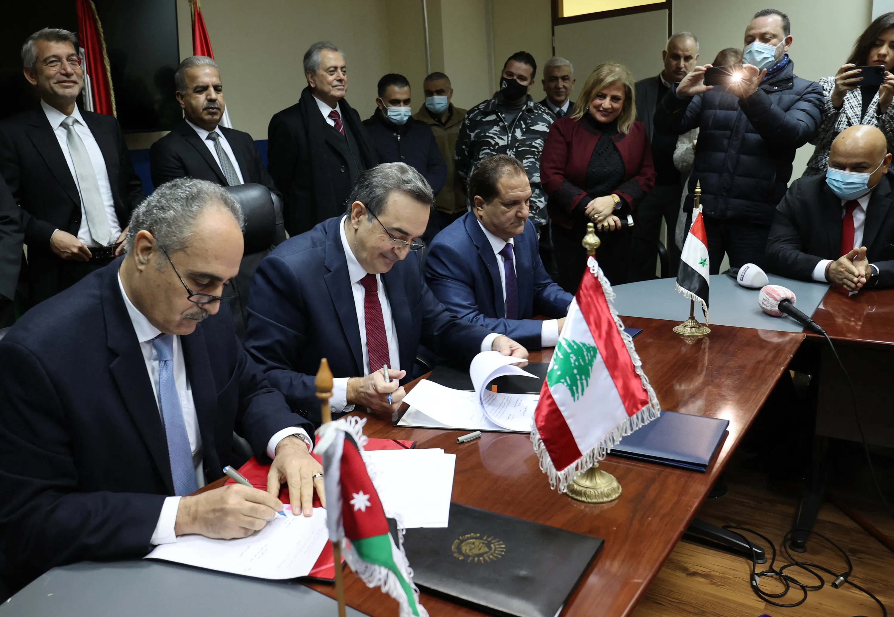 Jordanian National Electric Power Company Managing Director Amjad Rawashdeh, Electricity of Lebanon Drector Kamal Hayek, and Syrian Electricity Transmission and Distribution General Manager Fawaz al-Zaher, sign a deal to supply Lebanon with electricity&nbsp;in Beirut, Lebanon, on Jan. 26.&nbsp;&nbsp;