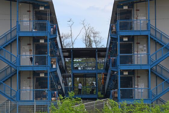Singapore Keeps Dorm Migrants Segregated Even as Covid Abates