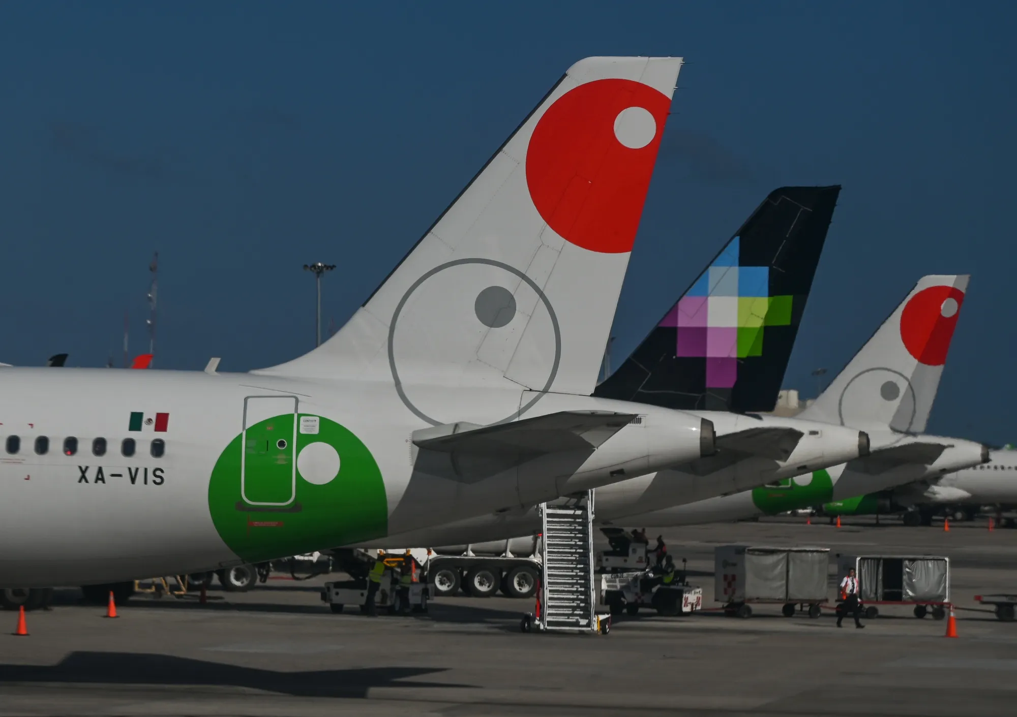 Mexico’s Viva and Volaris, center, low-cost carriers plan&nbsp;to merge.