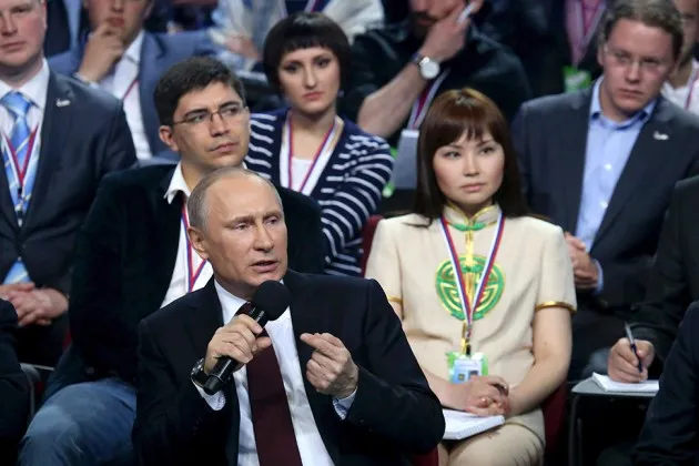 Russian President Vladimir Putin talks during a meeting with regional journalists and supporters of the People's United Front on April 24 in Saint Petersburg, Russia