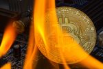 Symbol photo Bitcoin crash. The picture shows a burning Bitcoin.