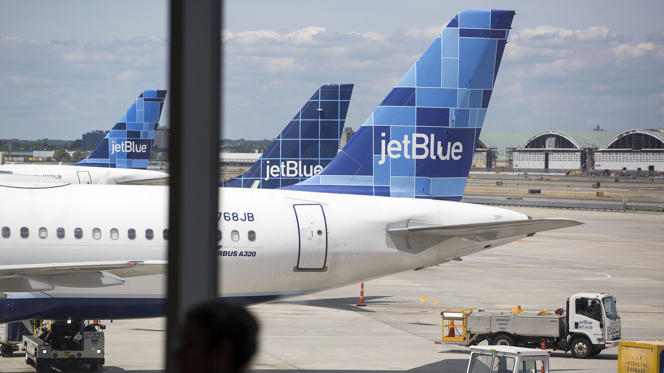 JetBlue Airways Corp. planes sit on tarmac.
