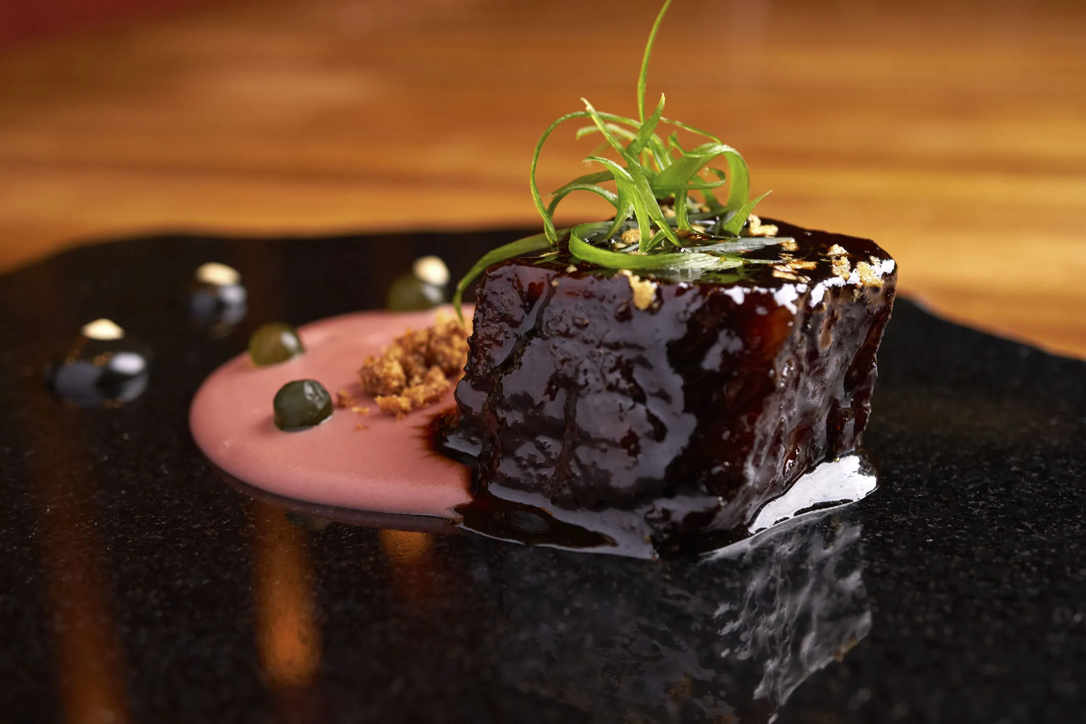 Beef short ribs with camotillo potato cream and purple corn powder at Maido in Lima.