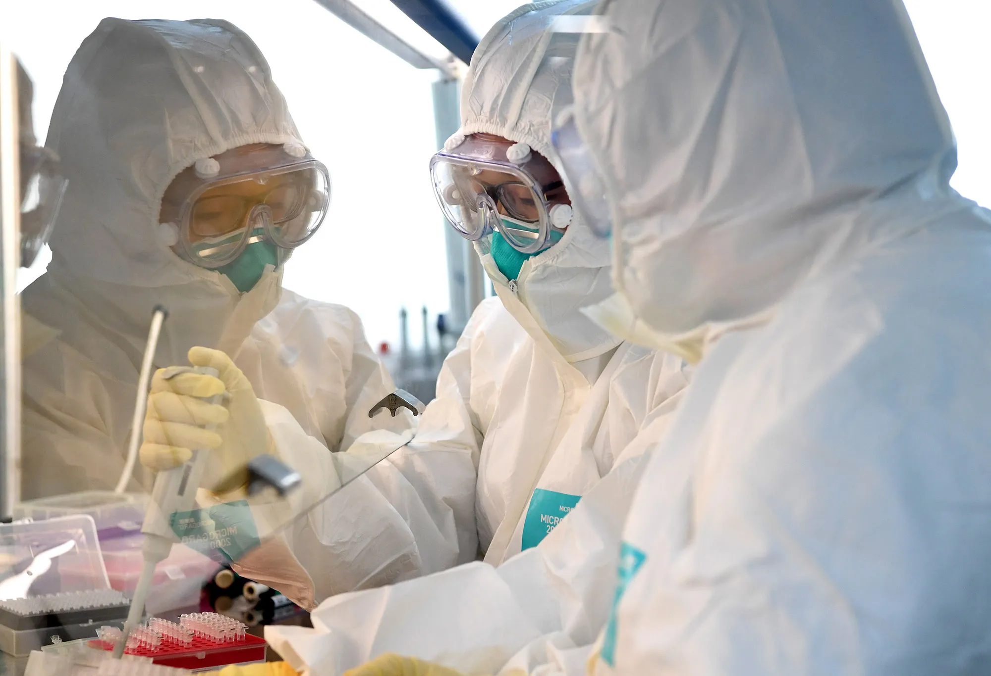 Researchers work at a laboratory of the disease prevention and control center in Nanyang, central China's Henan Province.