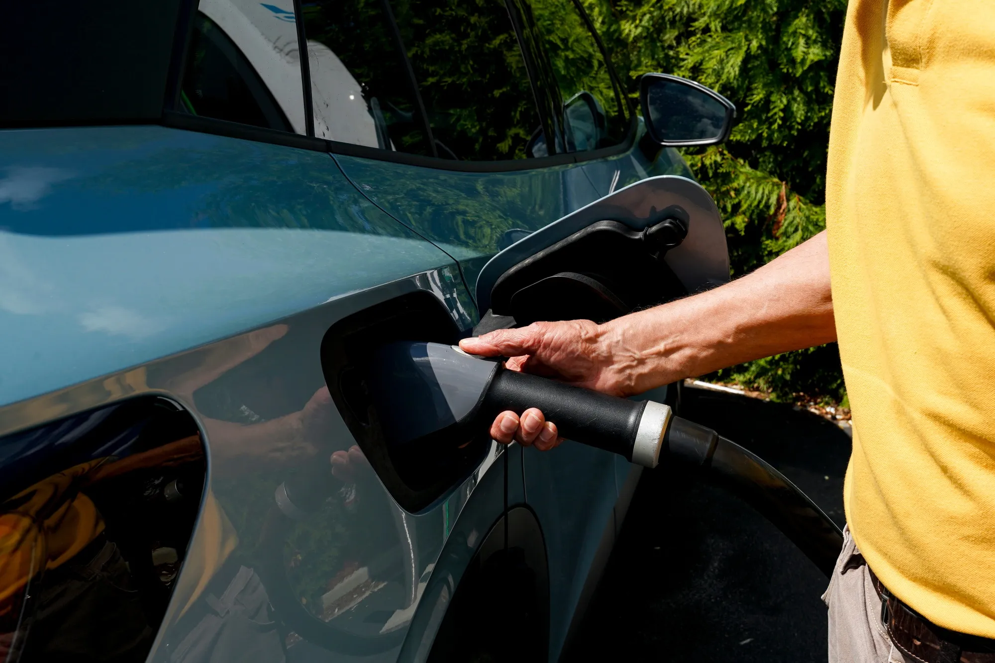 A driver unplugs their electric vehicle&nbsp;at a charging station in Atlanta, Georgia. Along with the Rust Belt, the Southeast is becoming a hotspot for new charging infrastructure.