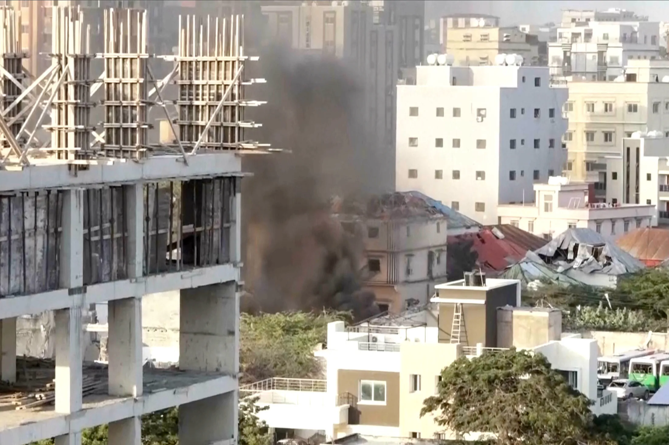 Smoke fills the sky as explosions and heavy gunfire erupted near Somalia’s presidential palace in an attack by a militant group in Mogadishu, Somalia, on Oct. 4.