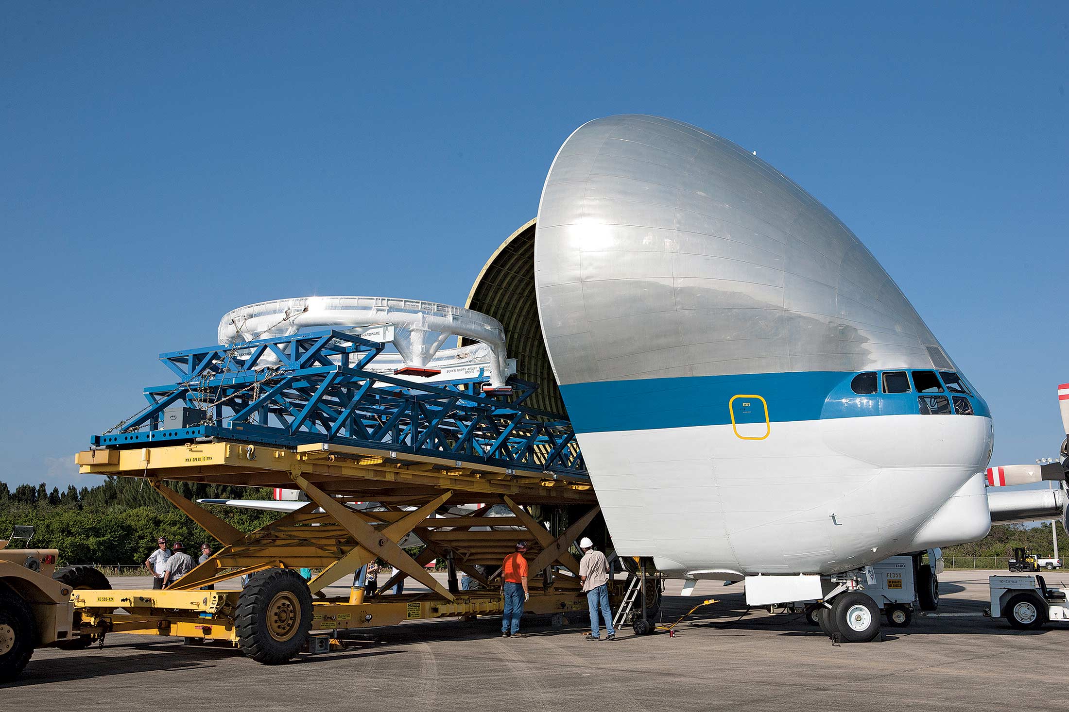 Loading portions of the Orion service module into a NASA transporter in Florida.
