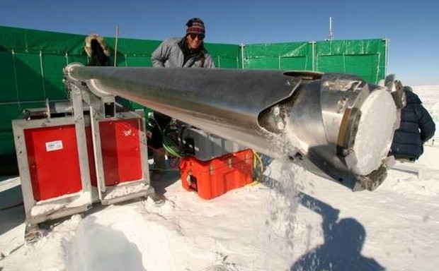 Researchers drill into the ice during a survey of Antarctica.
