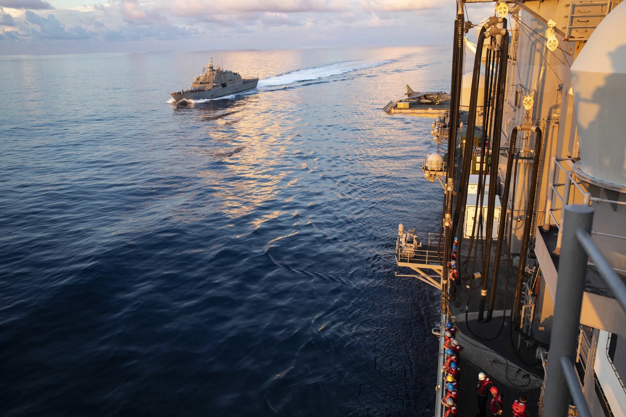 USS Milwaukee, left, approaches USS Bataan for a fueling-at-sea operation in October.