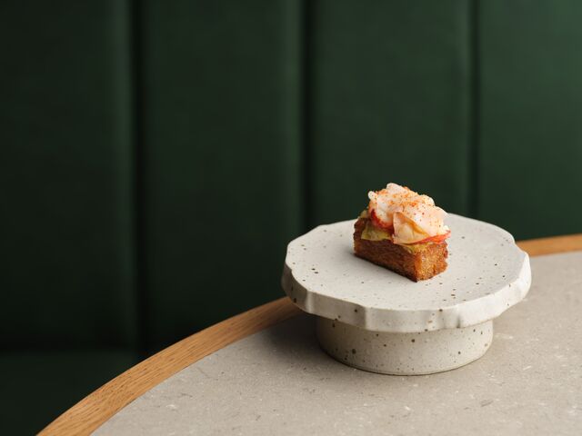 A perfect bite of lobster on on grilled sourdough that had been soaked in shellfish jus at Skof.