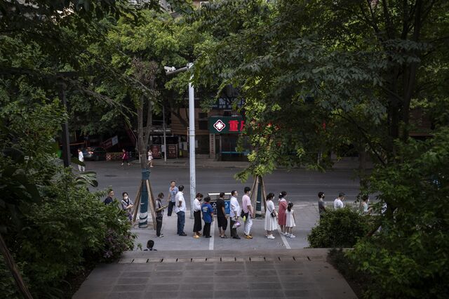 People queue for Covid tests, a common ritual in today's China.