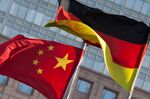 Chinese and German flags fly in Beijing