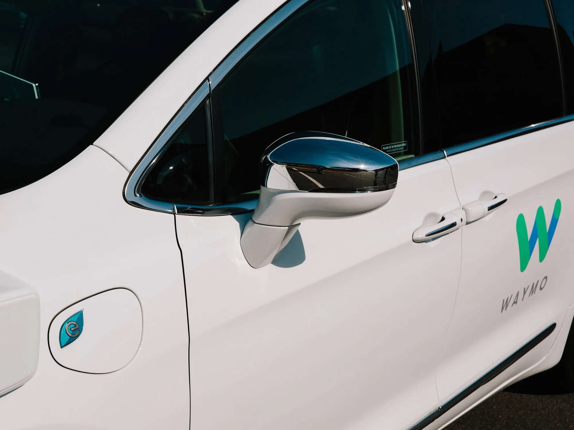 The side mirror of a Waymo autonomous vehicle in Arizona