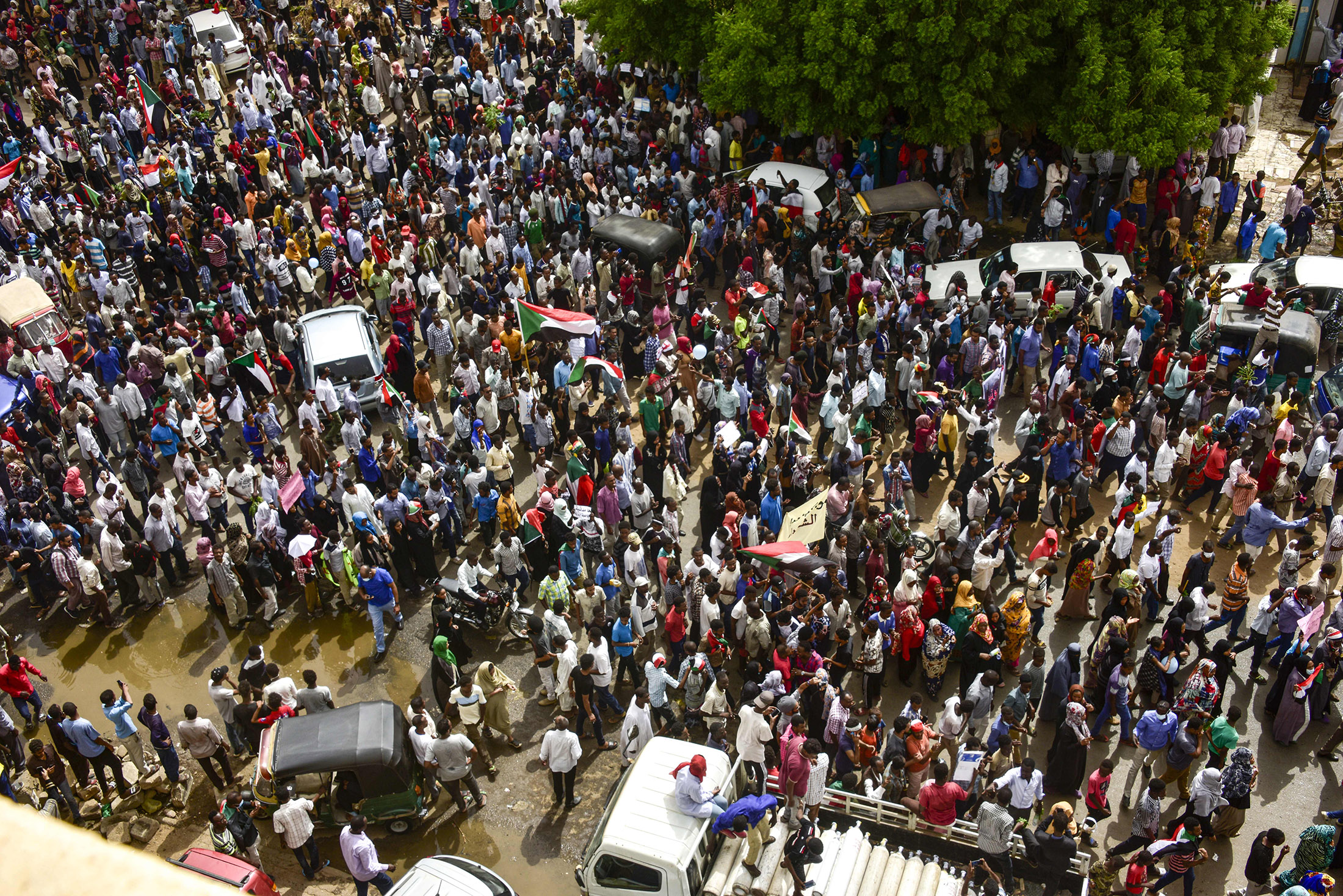 Sudanese protesters march in a mass demonstration on June 30.
