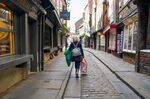 A shopper walks along the Shambles in York, UK.