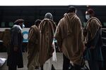 Refugees board a bus to a refugee processing center after being evacuated from Kabul, in Dulles, Virginia, U.S., on Aug. 31.