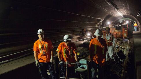 Amtrak crew members work at a repair site in the north tube of the North River Tunnel under the Hudson River near near Weehawken, New Jersey, on Aug. 21, 2015.