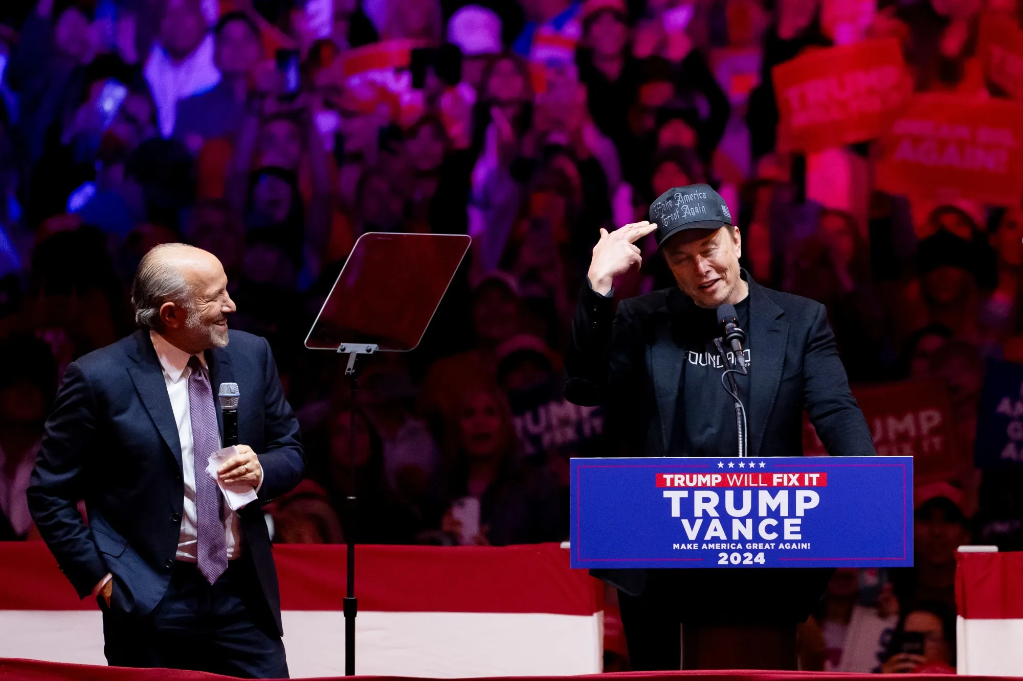 Howard Lutnick, chairman of Cantor Fitzgerald, left, and Elon Musk, chief executive of Tesla, during a campaign event for Donald Trump at Madison Square Garden in New York on Oct. 27.