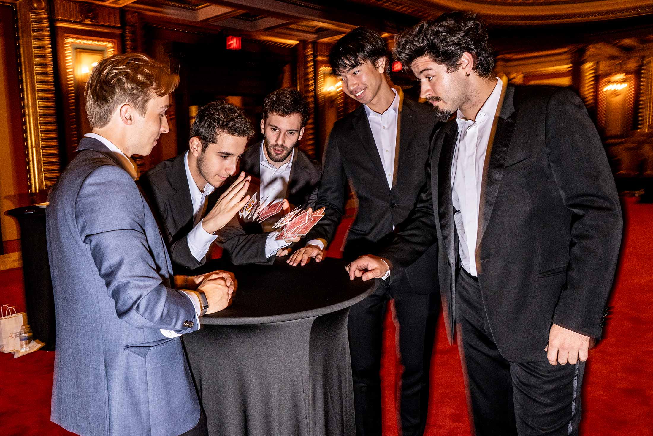 Midnight Madness magicians practice their tricks before teams arrive at Masonic Hall.