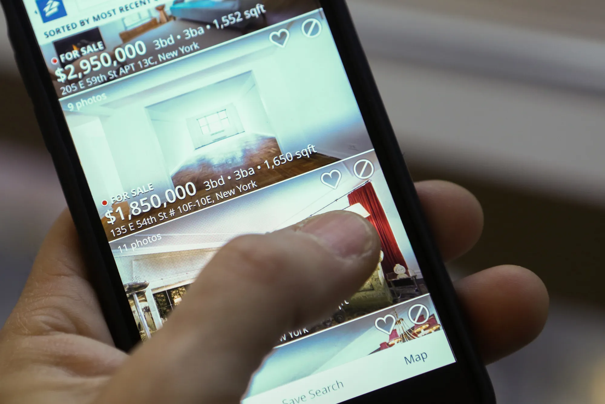 The Zillow Group Inc. application is displayed on an Apple Inc. iPhone.