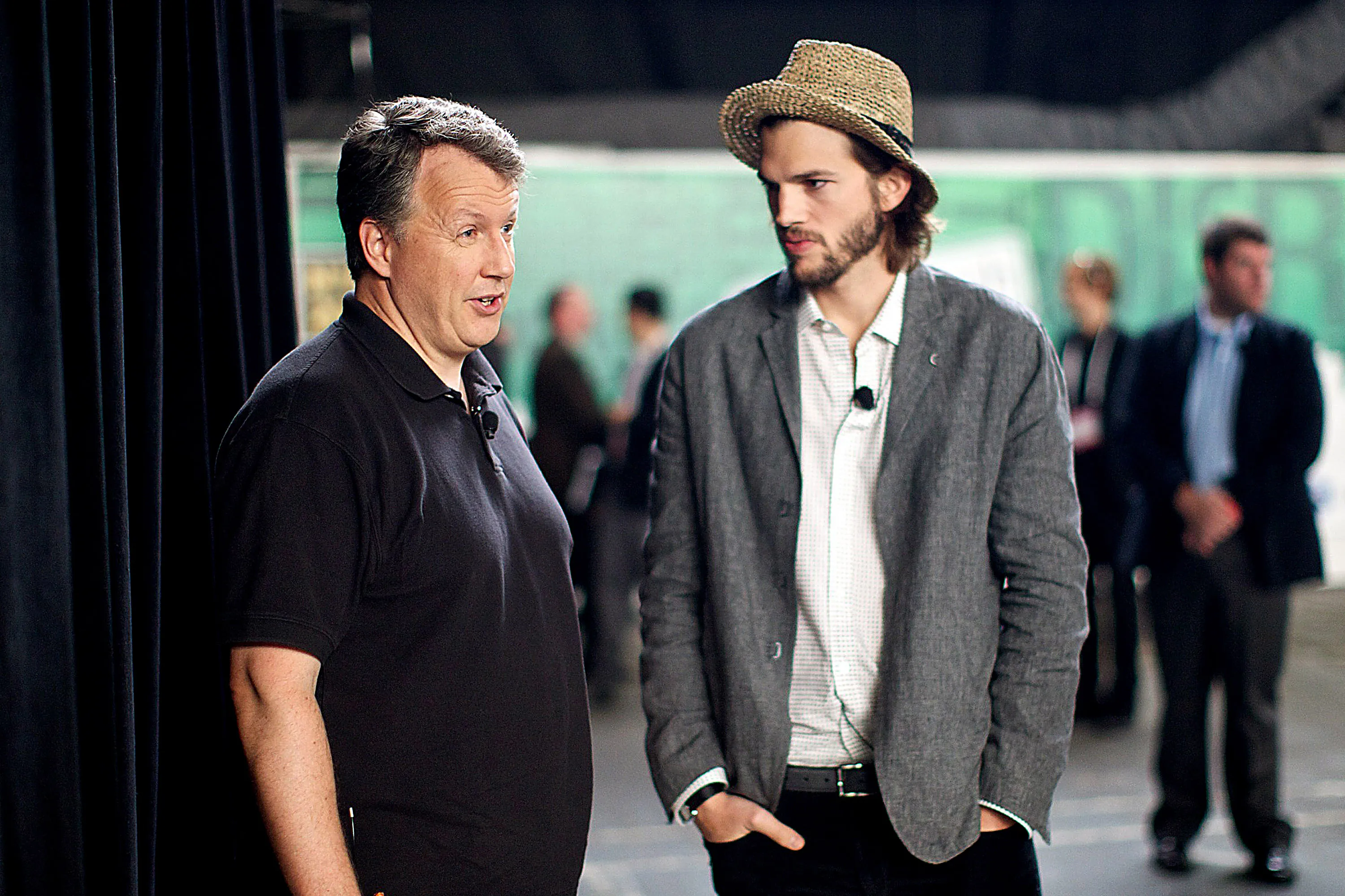 Actor Ashton Kutcher, right, speaks with Paul Graham, co-founder of Y Combinator, in New York. Photographer: Guy Calaf/Bloomberg