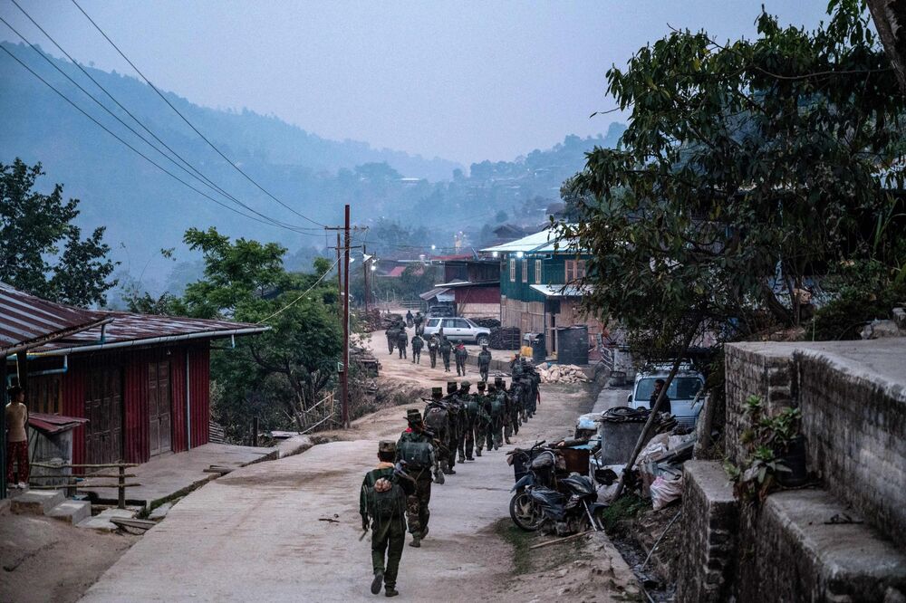 Members of ethnic rebel group Ta'ang National Liberation Army patrol near Namhsan Township in Myanmar's northern Shan State.