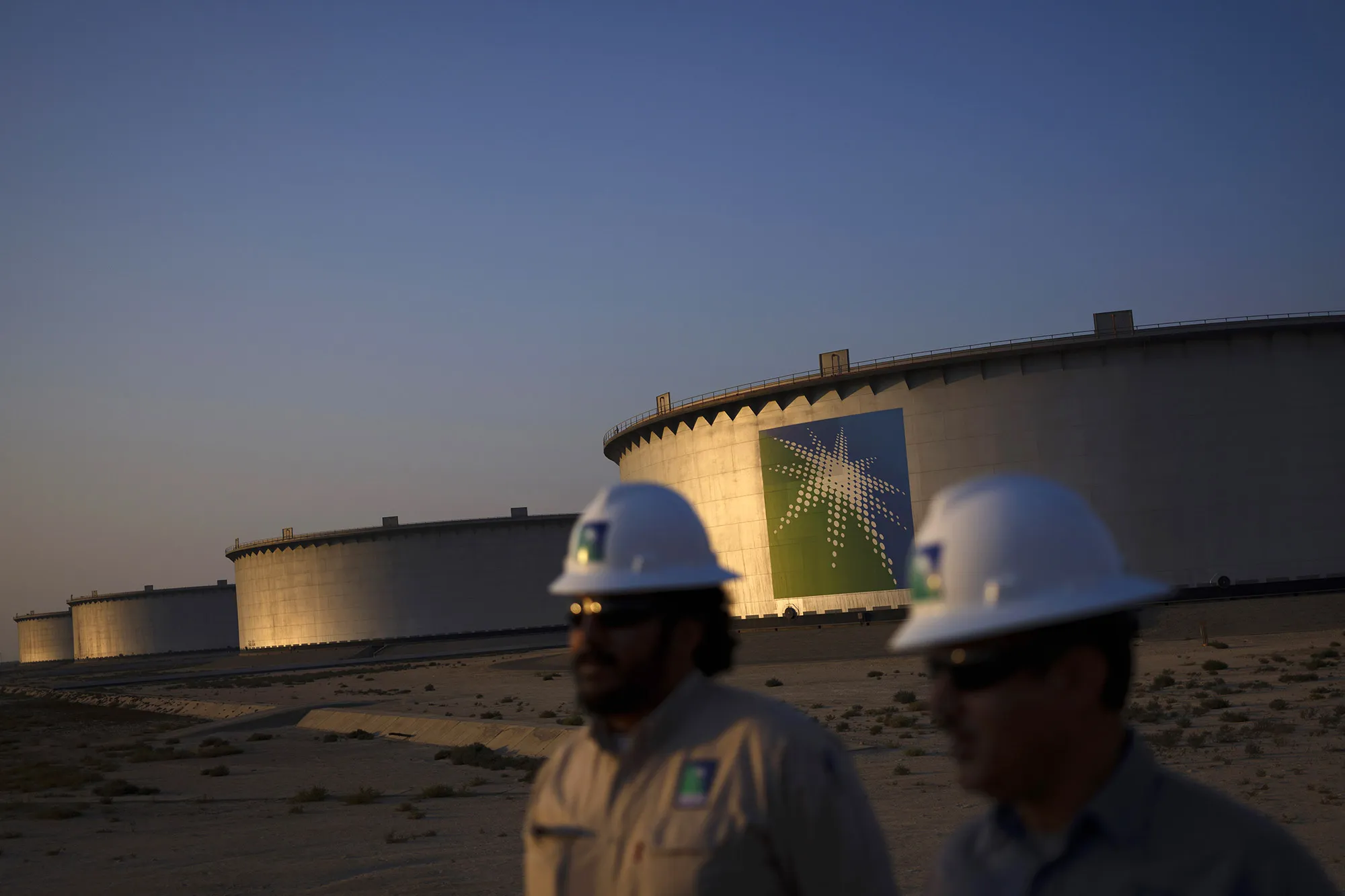 Crude oil storage tanks stand in the Juaymah tank farm at Saudi Aramco's Ras Tanura oil refinery.