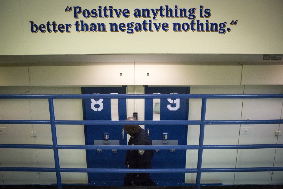 A corrections officers walks through the Rikers Island Correctional facility in New York.