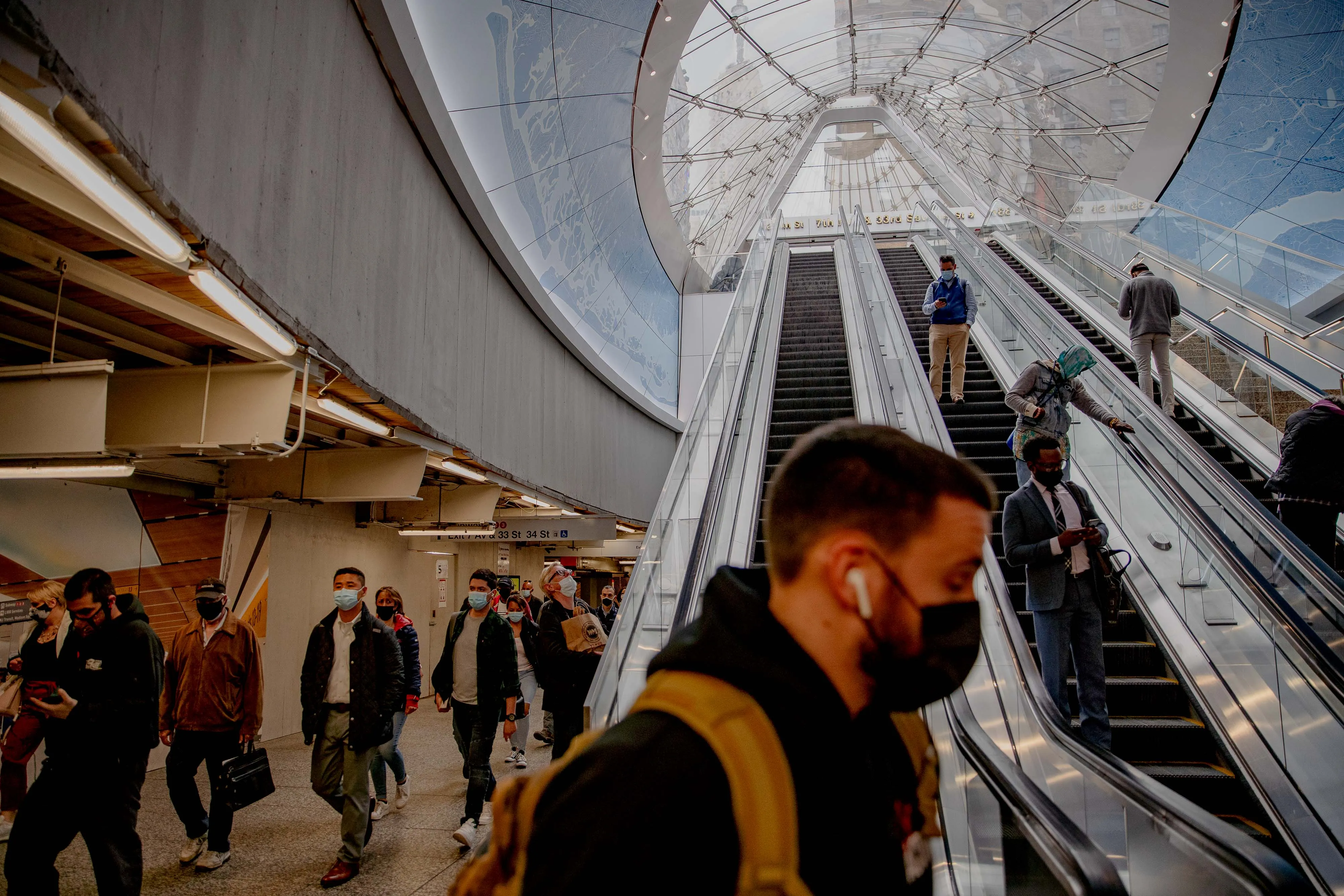Commuters walk through Pennsylvania Station in New York, U.S.