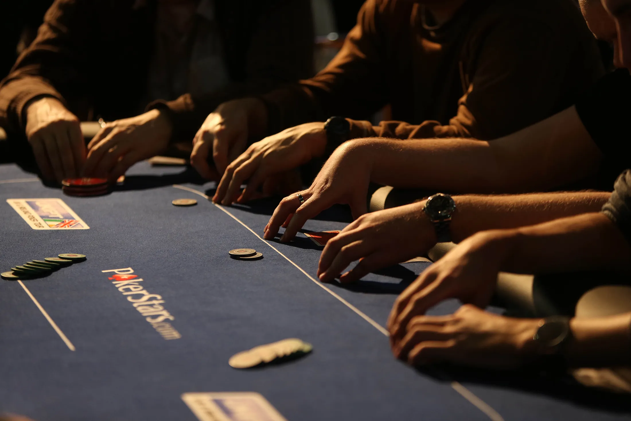 Competitors sit at a table&nbsp;during&nbsp;a PokerStars&nbsp; tournament.