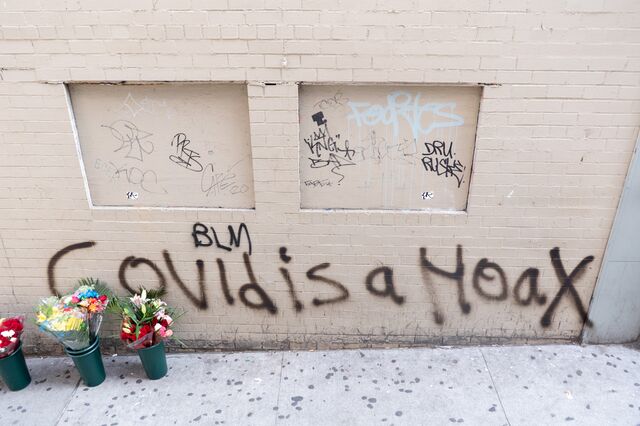 "Covid is a hoax" graffiti, Broadway at West 125th Street, Harlem