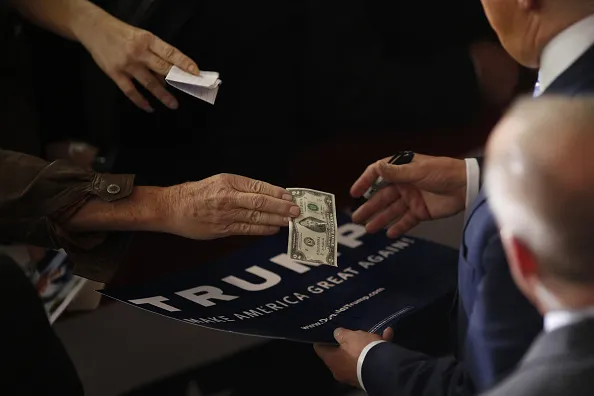 Cashing in.
