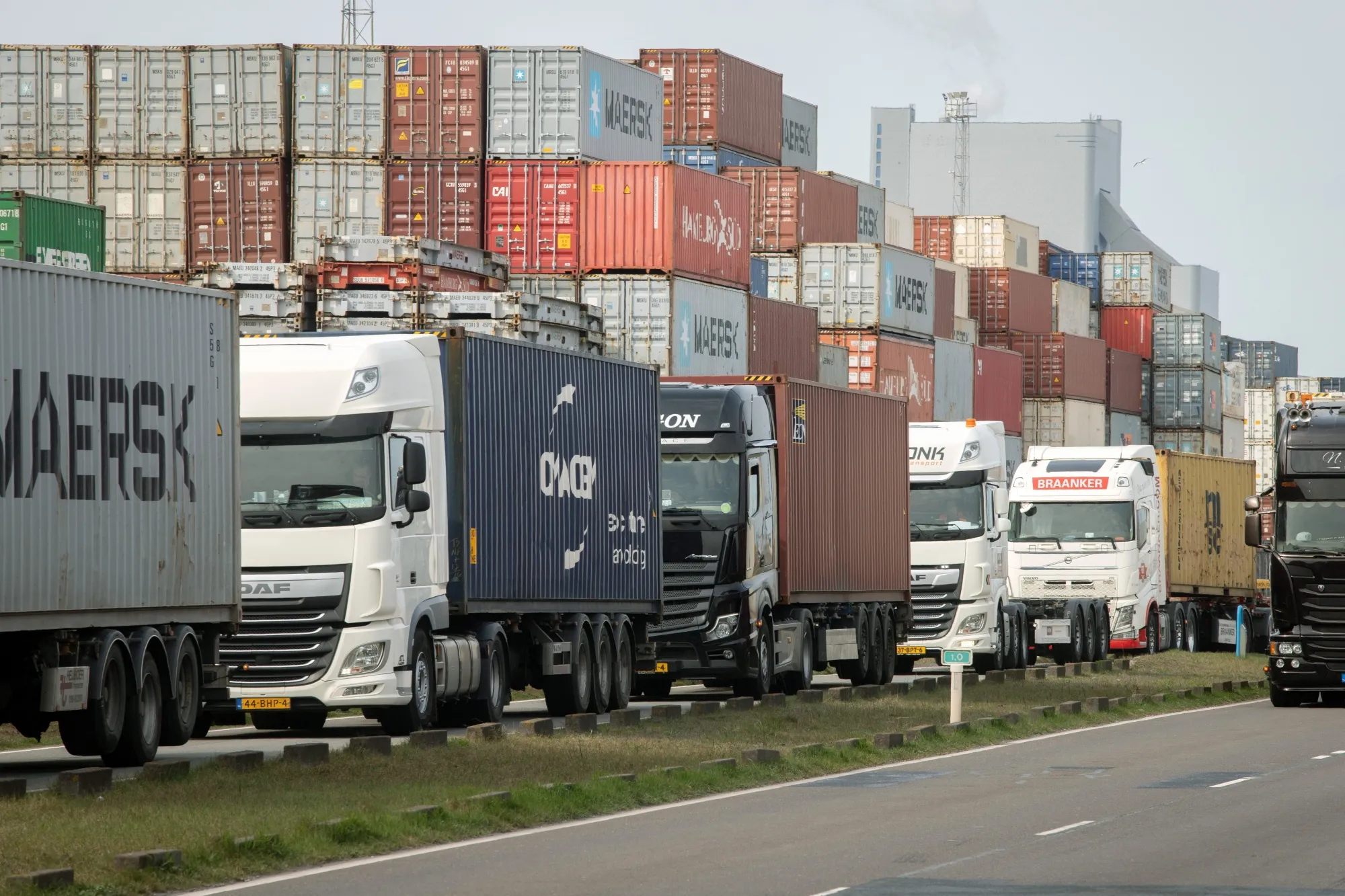 Trucks lined up next to shipping containers idled due to Russia sanctions, at the Port of Rotterdam in the Netherlands in March.