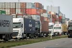 Trucks lined up next to shipping containers idled due to Russia sanctions, at the Port of Rotterdam in the Netherlands in March.