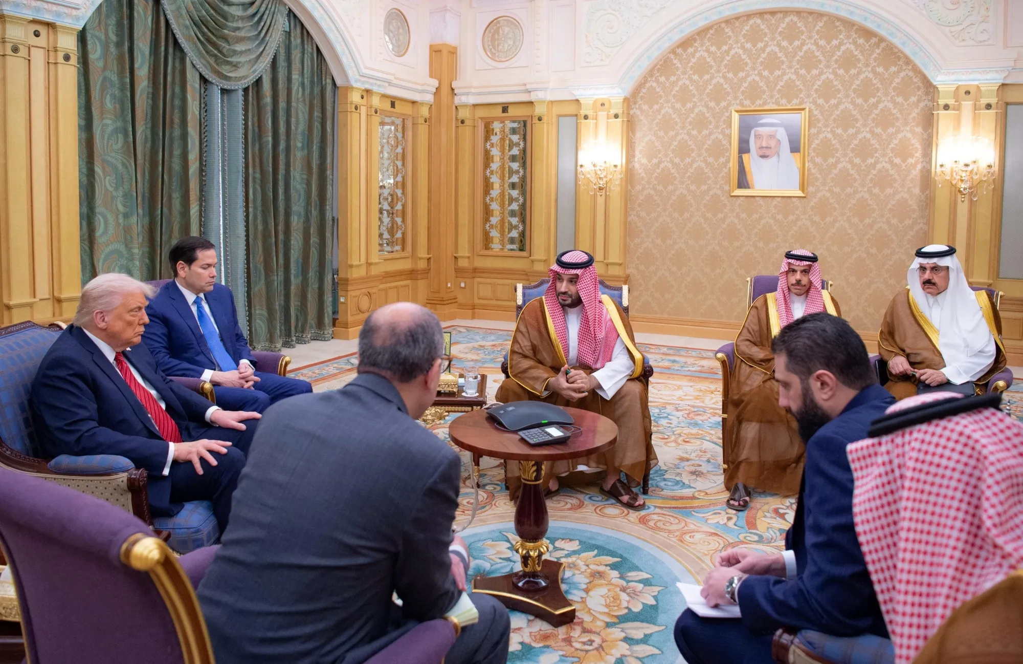 US President Donald Trump, left, with Crown Prince Mohammed bin Salman, center, and Ahmed al-Sharaa, front right, attend a meeting in Riyadh on May 14.