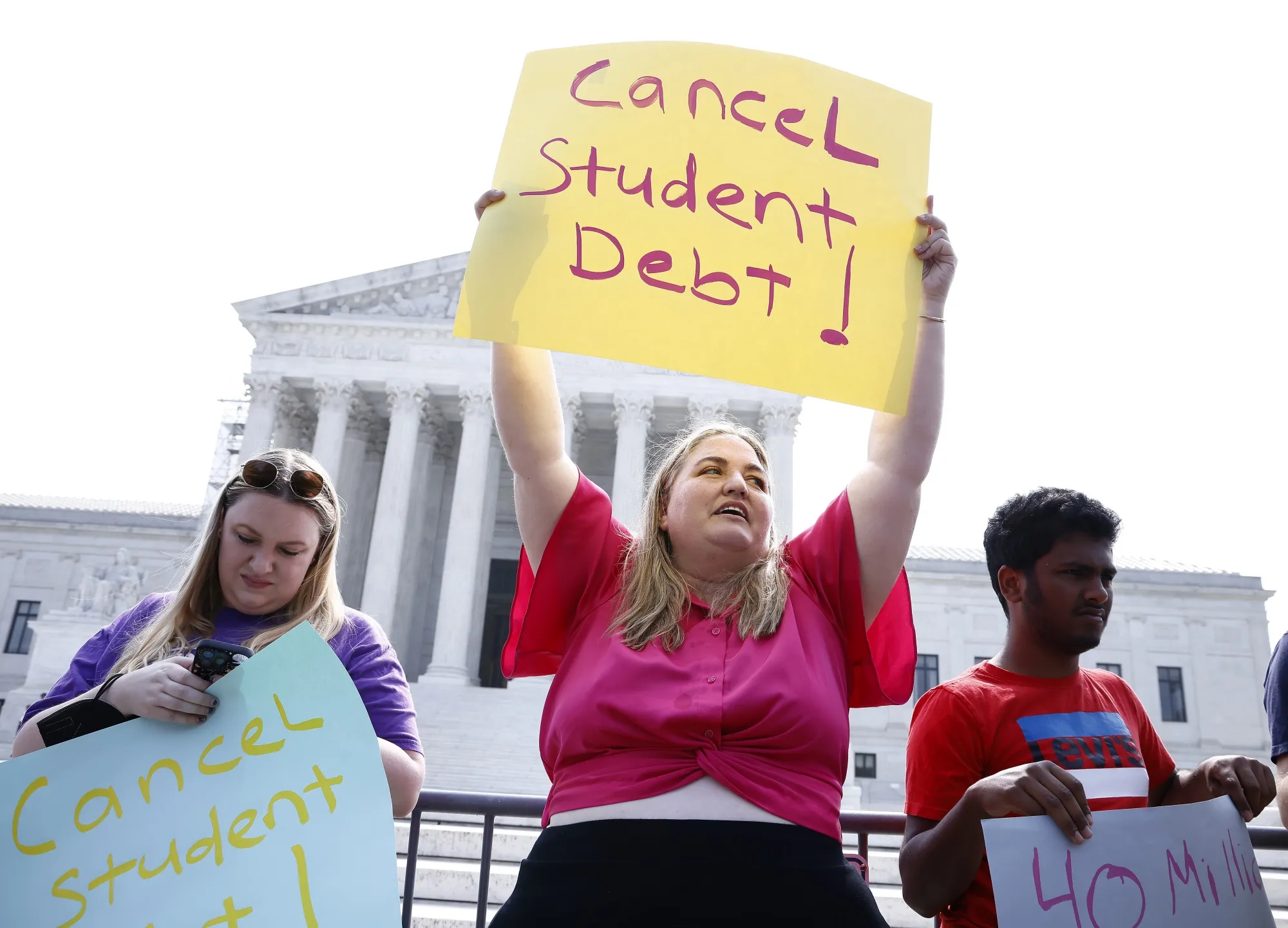 Student loan borrowers protest outside the Supreme Court in Washington.