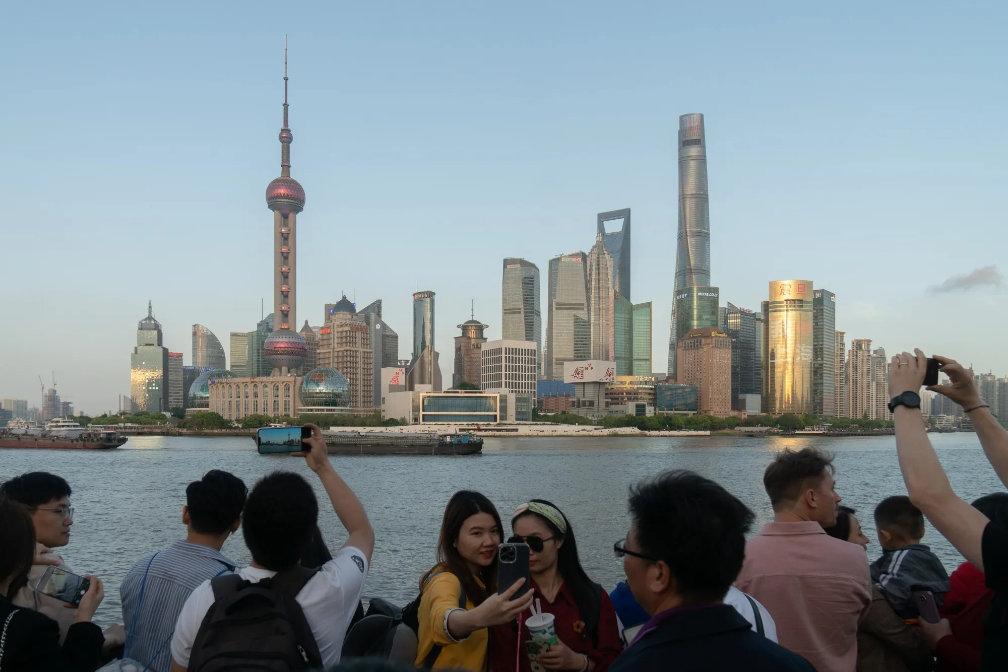 Tourists visit the Bund in Shanghai on April 20.