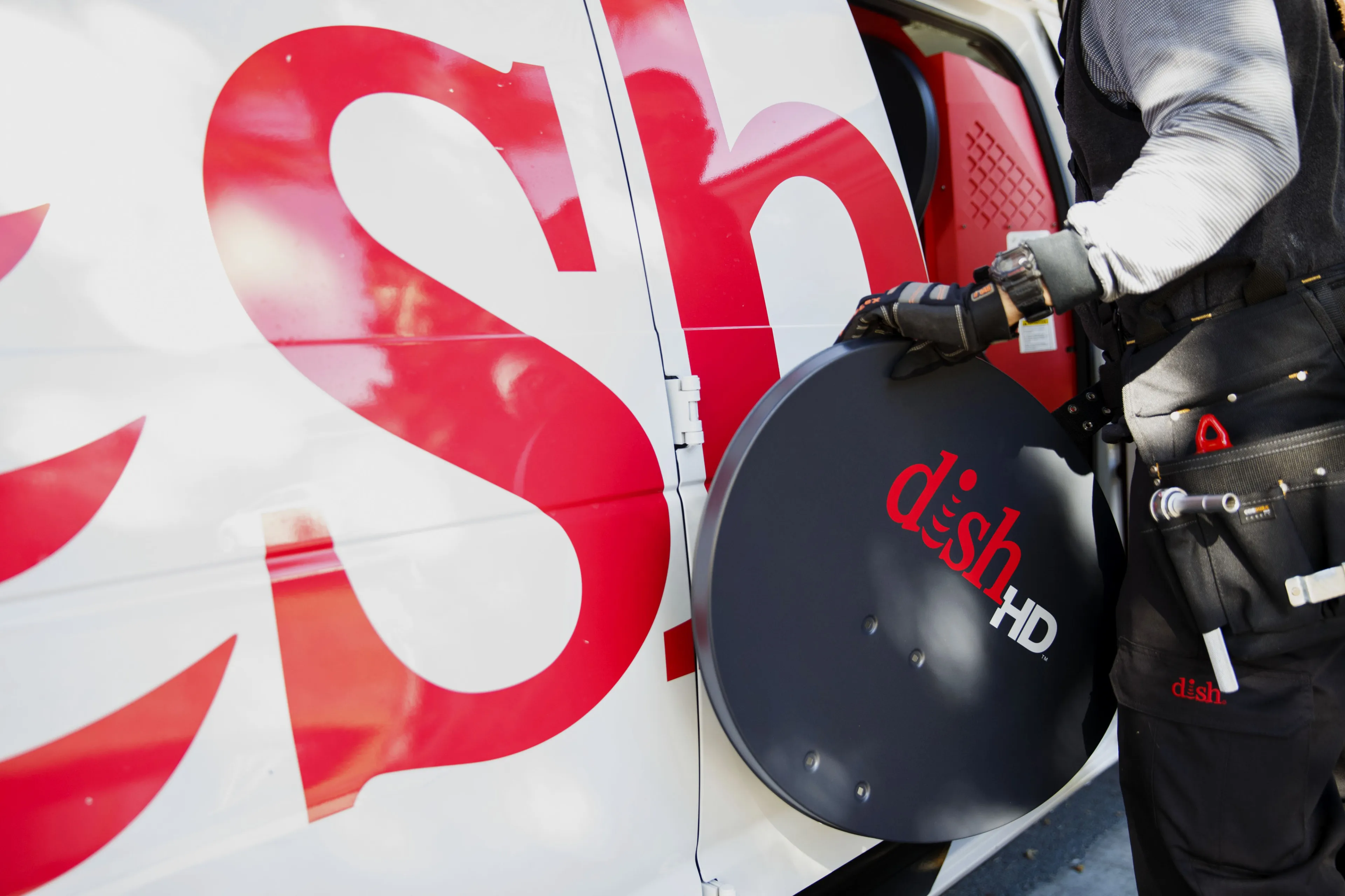 A Dish Network Corp. field service specialist prepares to install a satellite television system at a residence in Paramount, California.