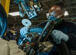 An employee inspects a tire at a bicycle production facility in Manning, South Carolina.