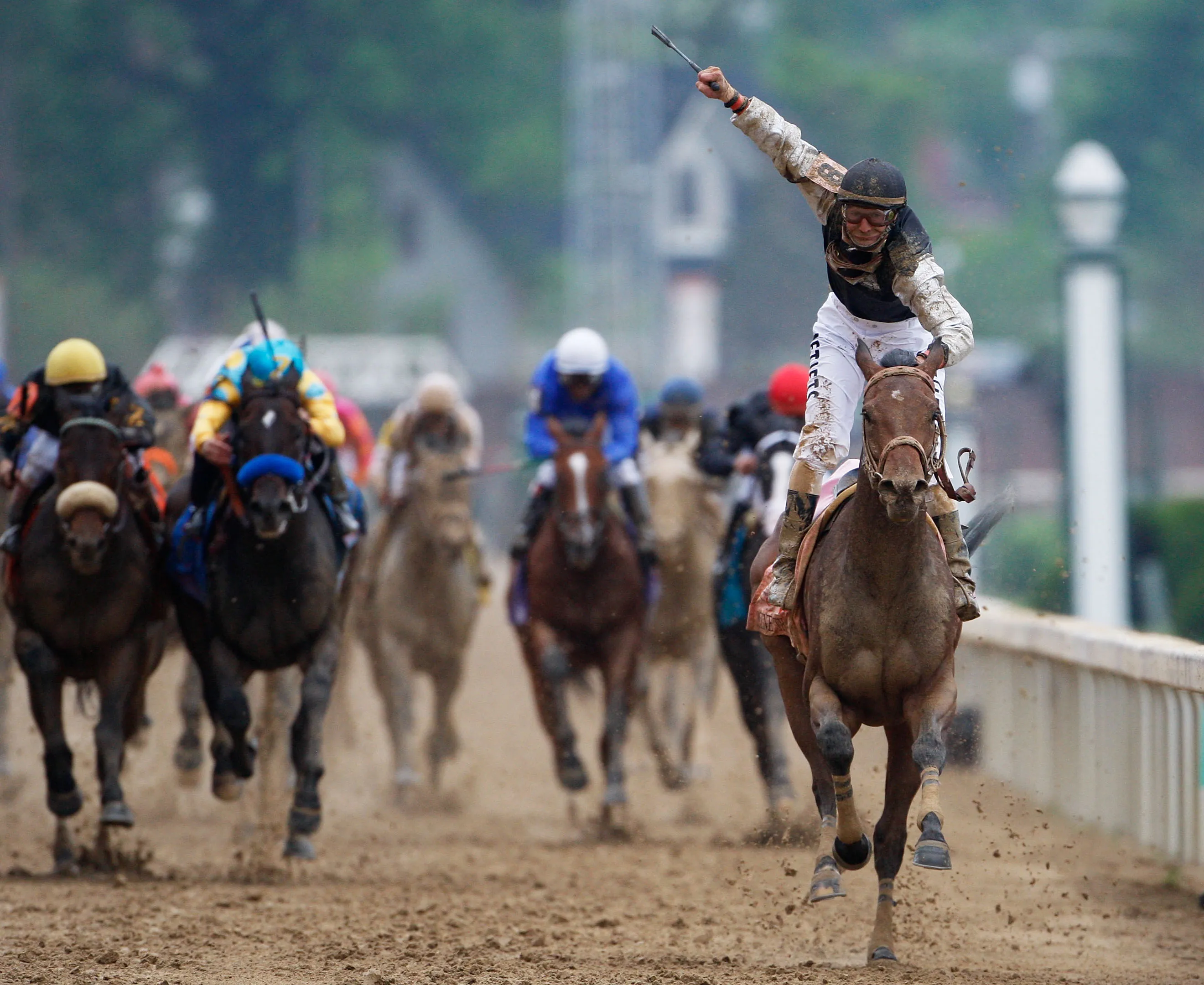 Jockey Calvin Borel atop Mine That Bird crosses the finish line to win the 135th running of the Kentucky Derby in 2009.