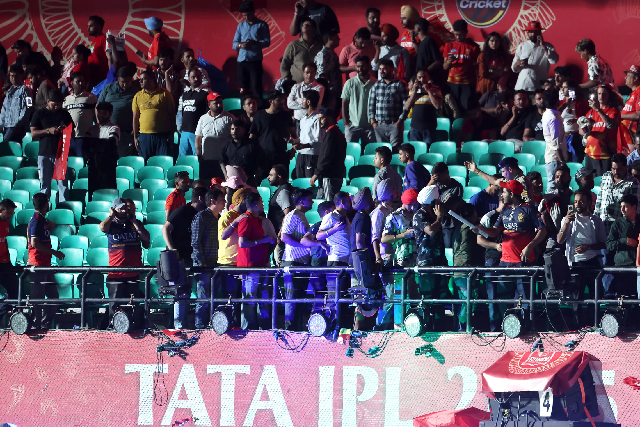 Spectators leave an IPL match after evacuation orders at the Himachal Pradesh Cricket Stadium in Dharamsala, India, on May 8.