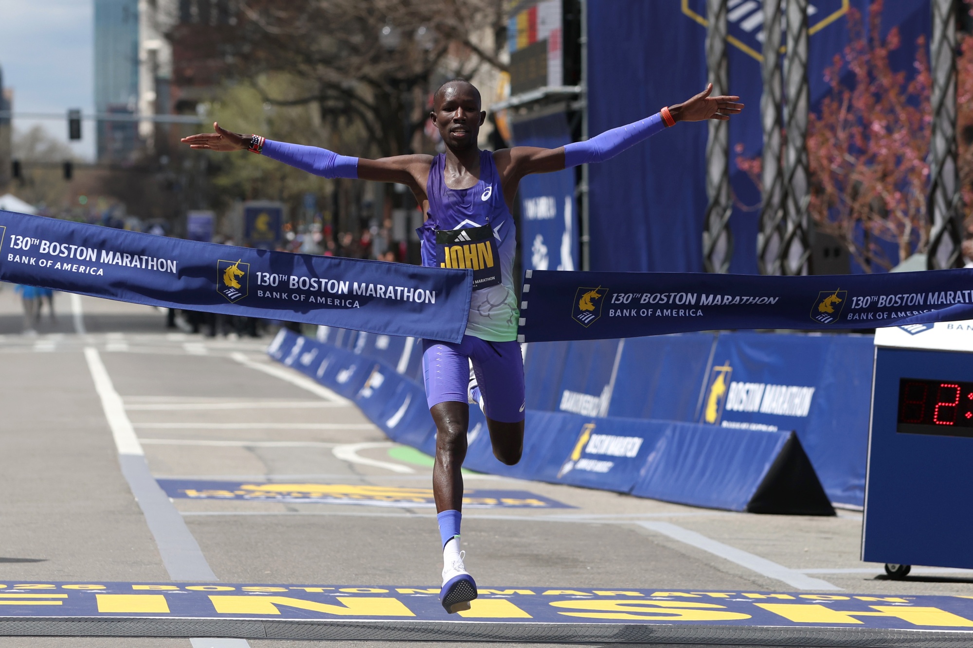 John Korir of Kenya crosses the finish line to win the men's Boston Marathon on April 20. Photographer: Paul Rutherford/Getty Images