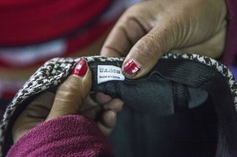 A label reading 'Made In China' is seen on a hat a store in Kyongnosla.